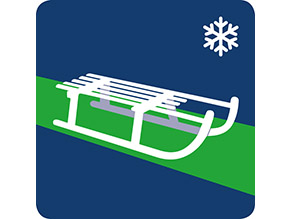 Ein Schlitten auf einer grünen Spur,  mit Wintersymbol.