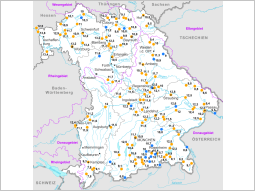 Bayernkarte mit den Wassertemperaturmessstellen an Fließgewässern und dem Jahresmittelwert 2021 in °C.